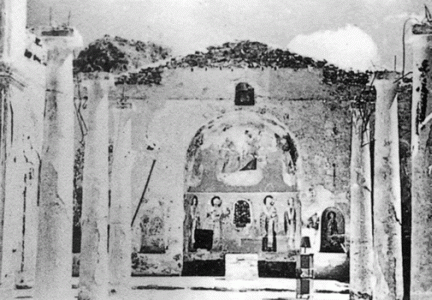 Η Ιερά Μονή Αγίας Λαύρας μετά την πυρπόληση από τους Γερμανούς στις 14 Δεκεμβρίου 1943.